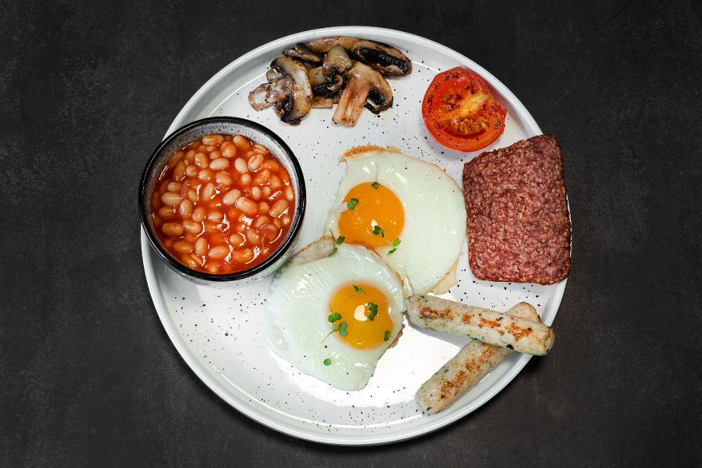 The cooked breakfast — fried eggs, beans, mushrooms, tomato, sausages